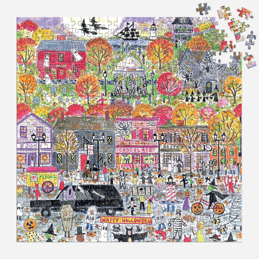 A vibrant and detailed Michael Storrings Halloween Parade 500-piece jigsaw puzzle by Galison, featuring a spooky procession of monsters and witches.