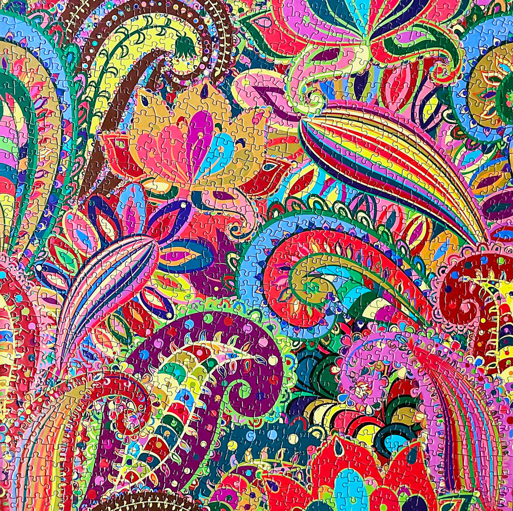 Shop the 1000-piece Psychedelic Colour Flower Dance Jigsaw Puzzle from Rest In Pieces UK - an easy challenge for avid puzzlers.