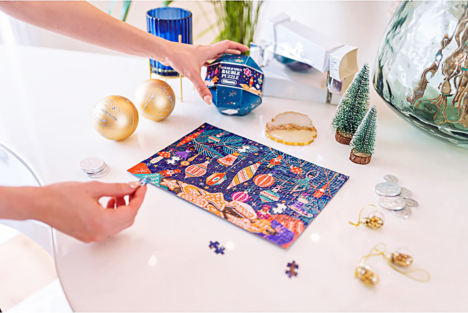 Gibsons Sugar and Spice Puzzle Bauble includes a 200-piece Christmas-themed jigsaw puzzle.