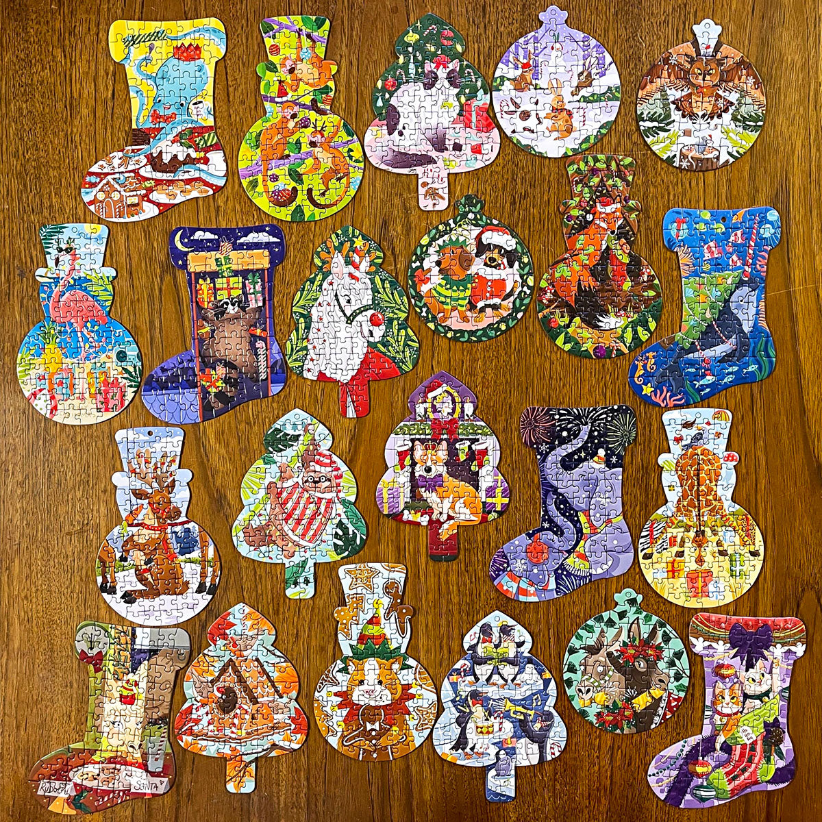 Behind the doors, you’ll find a festive shaped puzzle (snowman, tree, bauble, stocking). Each design features a mischievous animal getting in the Christmas spirit. And behind two doors are puzzle glue and ribbon, so you can craft your own decorations.