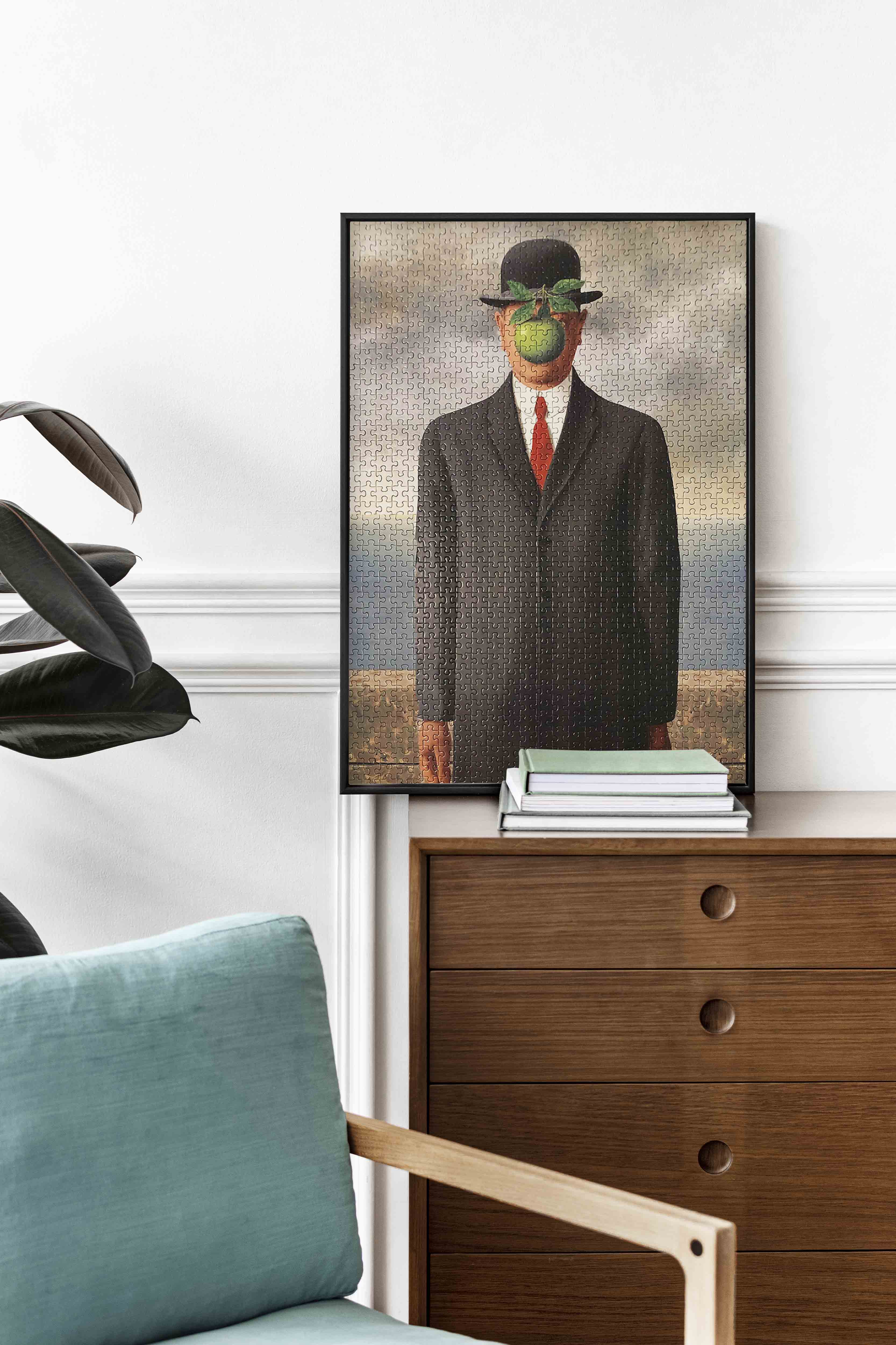 Magritte's Son of Man. Iconic surrealism painting with bowler hat and green apple. High-quality jigsaw puzzle for interior design and art lovers.