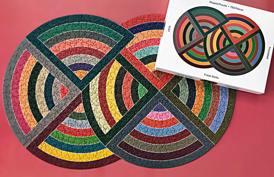 This brilliant adult jigsaw puzzle includes Frank Stella's Firuzabad painting with stunning colours and his iconic aesthetic. One side is glossy while the other is matte, so it's easy to sort the pieces. Perfect for a calm evening.