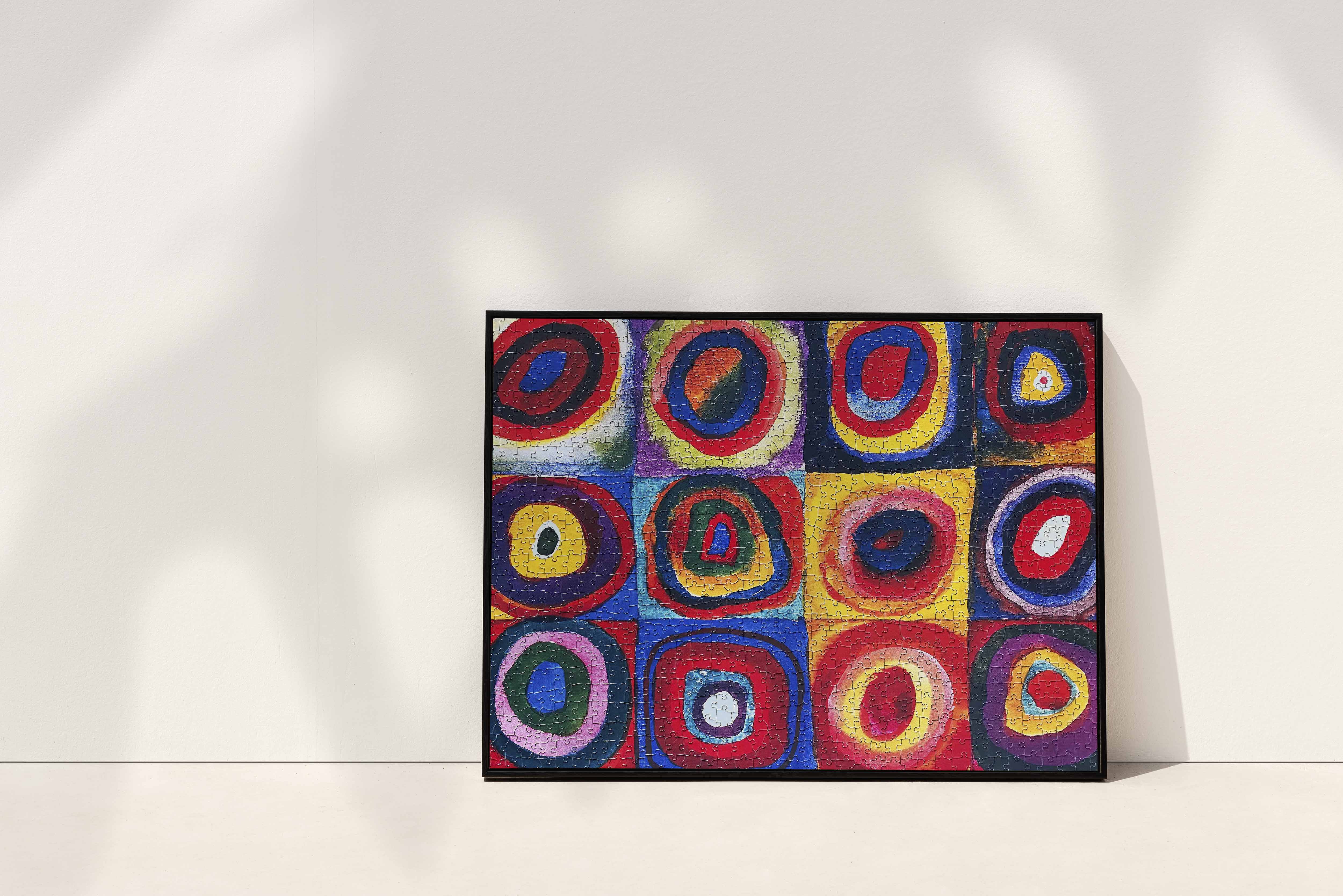 Wassily Kandinsky Color Study Squares with Concentric Circles Jigsaw Puzzle displayed in a black picture frame
